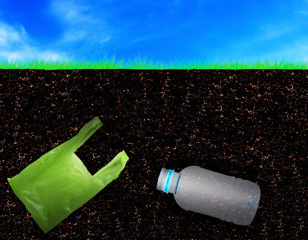 Pollution soil problem concept, bury plastic bag and bottle