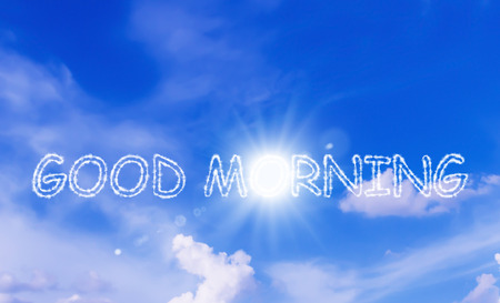 Good morning and wake up concept, cloud text on blue skyの写真素材