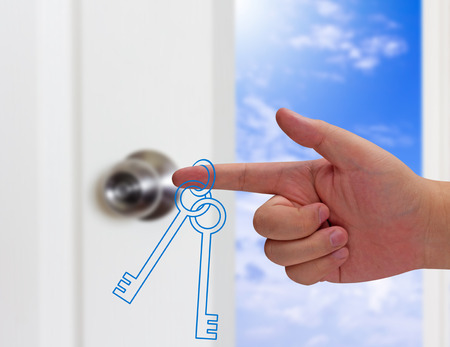 Business success concept, hand holding key target to growth and achievementの写真素材