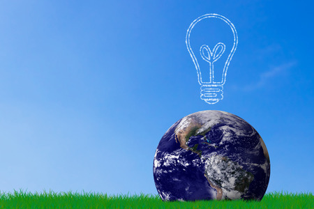Green energy concept, the earth and light bulb on grass background, nature and ecology, Elements of this image furnished by NASAの写真素材