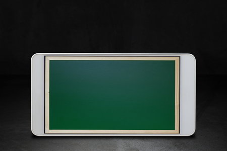 Education technology, online learning concept, mobile phone and chalkboard backgroundの写真素材