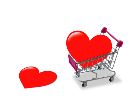 Two red paper hearts and trolley on white background, valentine day, romantic and falling in love concept, love shopping の写真素材