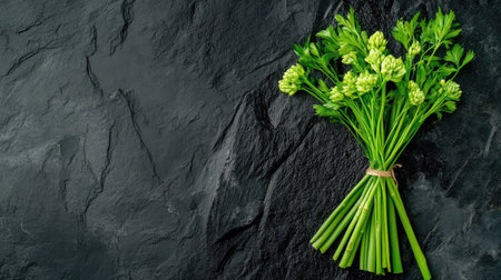 Top-down view of vibrant asparagus on rough black stone, healthy and organic presentationの素材