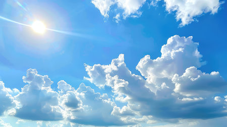 A stunning view of a bright blue sky adorned with fluffy white clouds and bright sunshine, creating a tranquil and serene atmosphere ideal for relaxation.の素材
