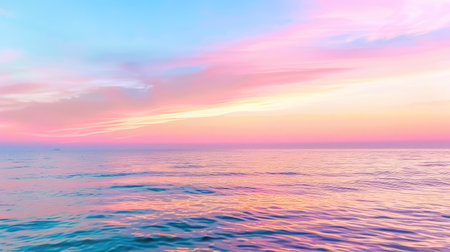 A breathtaking view of a tranquil ocean at sunset, displaying vibrant pink and blue hues across the sky. The calm water mirrors this stunning phenomenon, creating a serene atmosphere perfect for relaxation and reflection.の素材