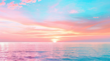 A stunning view of a tranquil sunrise over calm ocean waters, showcasing a vibrant pastel sky filled with pink and blue hues, perfect for inspiring relaxation and peace.の素材