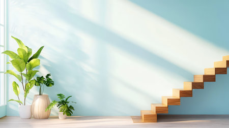 Bright and airy interior featuring wooden stairs and lush green plants against a soft blue wall. Perfect for showcasing modern design and tranquility.の素材
