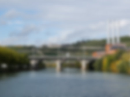 Blured bridge across the river with cloudy skyの写真素材