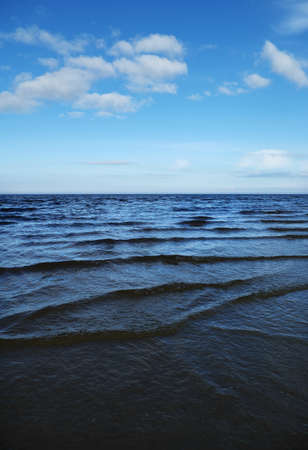 Dark Baltic sea`s water and blue sky.の写真素材