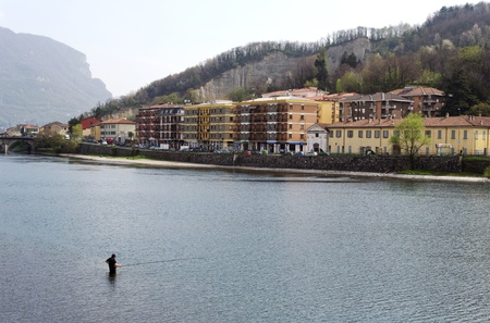 Fisherman in water of Como lake in Italia.の写真素材