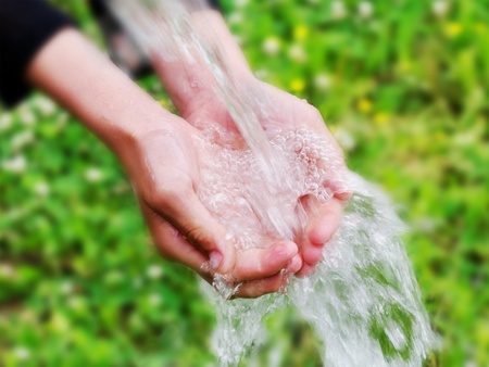 Flowing water on the hands.