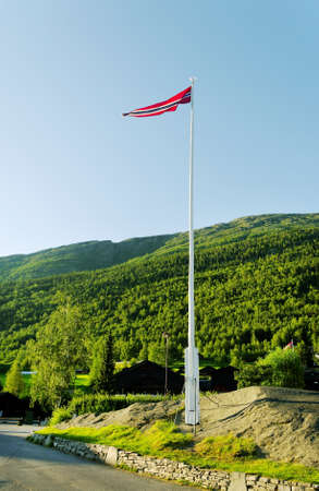 Flagpole with norway flag, vertical photo.の写真素材
