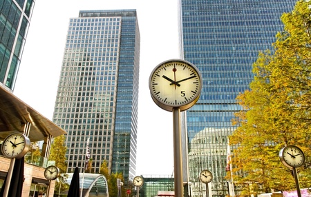 Downtown in the London with clocks and skyscrapers.のeditorial素材