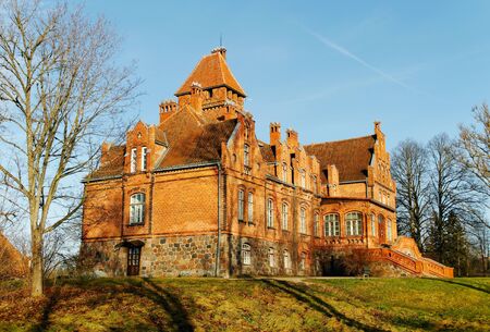 Castle from red brick on a hill.