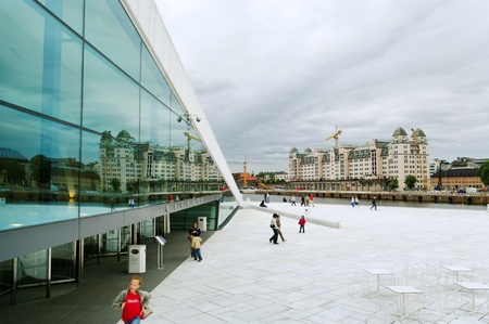 Side of norway opera building and reflation in it windows.