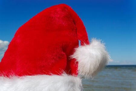Santa hat at the Baltic sea coastline の写真素材