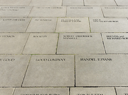 LONDON - OCTOBER 16: Inside in jard of Shakespeare's GlobeTheatre, letters on the pavement  in jard of Shakespeare's GlobeTheatre on October16, 2011 in London, UK のeditorial素材