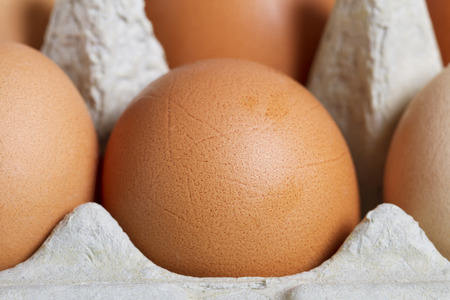Raw eggs in a box.
