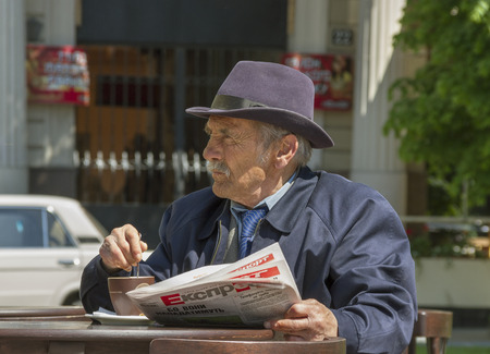 LVIV, UKRAIN - MAY 07:  Lviv is a city in western Ukraine. Man in street cafe at the Lviv Theatre of Opera and Ballet on 07.05. 2014, Ukrain, Lviv.のeditorial素材