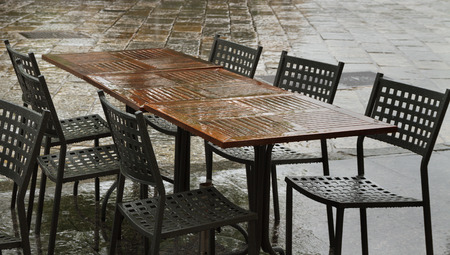 Closed cafe in rain time, Italy.の写真素材