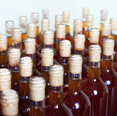 Bottles bright apple wine at the winery.の写真素材