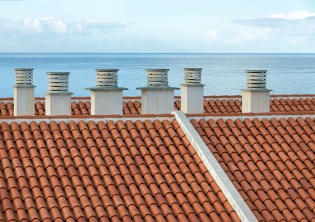 Chimney on a roof at the ocean.の写真素材