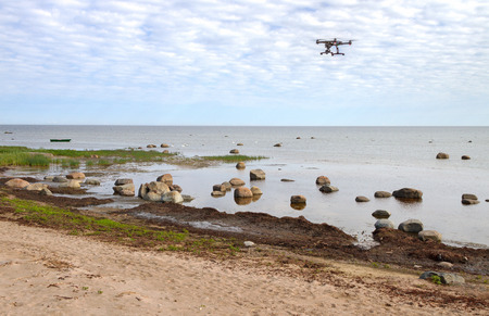 Stone Baltic sea in a spring time - paradise for birds. Flying drone above water.の写真素材
