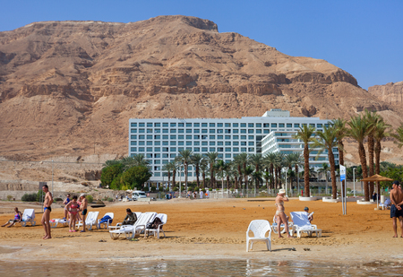 ISRAEL, DEAD SEA - OCTOBER 31: The Dead Sea is a salt lake bordered by Jordan to the east and Israel and Palestine to the west. It was one of the world's first health resorts. Relax at the Dead sea on 31 October 2016.のeditorial素材