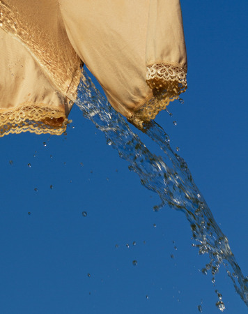 Wet female trousers symbolize the problem of urinary incontinence.の写真素材