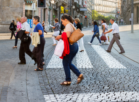 PORTO, PORTUGAL- SEPTEMBER 9: Porto is the second largest city in Portugal. View to the street of Porto where people crossing carriageway on 9 September 2016.のeditorial素材
