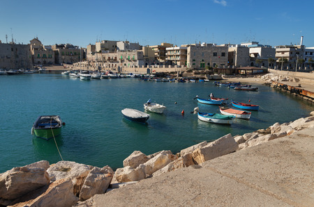 ITALY, GIOVINAZZO - OCTOBER 6: Giovinazzo is located on the Adriatic sea coast. Morning on coastline of Giovinazzo on 6 October 2017, Italy.のeditorial素材