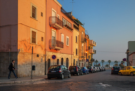ITALY, BARLETTA - OCTOBER 5: Barletta is located on the Adriatic sea coast. Street next to the coastline with cars in row on morning time, Barletta, 5 October 2017, Italy.のeditorial素材