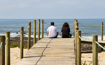 Wooden promenade at european sandy beach near sea.の写真素材