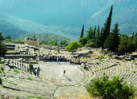 DELPHI, GREECE - 10 APRIL: Delphi, ancient town and seat of the most important Greek temple and oracle of Apollo. Group of tourists in Delphi on 10 April 2010, Greece.のeditorial素材