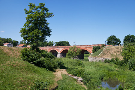 View to the old brick bridge in Kuldiga.の写真素材