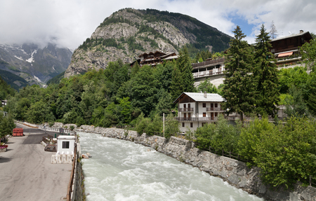 ITALY, COURMAYEUR - JULY 6: Courmayeur is a town in northern Italy, it is located next to Mont Blanc, what is the highest mountain in the Alps. View to the city on 6 July 2018, Courmayeur, Italy.のeditorial素材