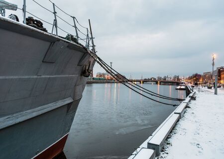 Grey ship on the canal in a city bay.の写真素材