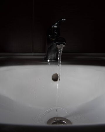 Water running down the drain.の写真素材