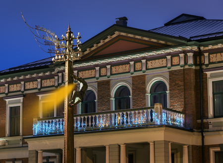 LATVIA, LIEPAJA - 24 DECEMBER: Liepaja is a city located on the Baltic Sea. View of the monument, where the image of the song called - City where the wind is born in night on 24 December 2018, Liepaja, Latvia.のeditorial素材
