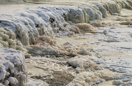 Frosty waterfall on the river Venta in Kuldiga, Latvia.の写真素材