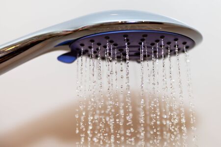 Head of shower with flowing water.の写真素材