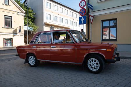 LATVIA, SALDUS - 19 SEPTEMBER: Saldus is a Latvian town. Along the city runs the RigaâLiepÄja highway. View to the street with old fashioned cars parade on 19 September 2020, Saldus, Latvia.のeditorial素材