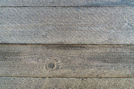 Surface of planks  in a first frost.