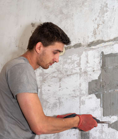 Repairman is working in house.の写真素材