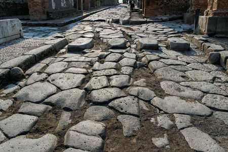 View to cobblestone road with crosswalk in Pompeii.