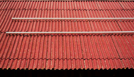 Montage of solar panel on a roof top.の写真素材