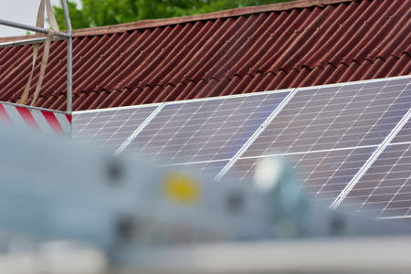 Montage of solar panel on a roof top.