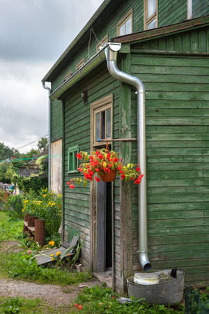 Old wooden house in a small city.の写真素材