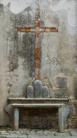 Antique cross on a street in Erice, Italy.の写真素材