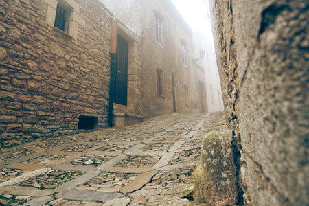 A traditional narrow stone lane in Erice.の写真素材